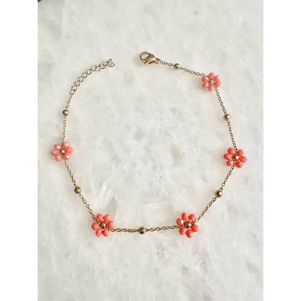 Delicate sparkly orange beaded flower chain bracelet